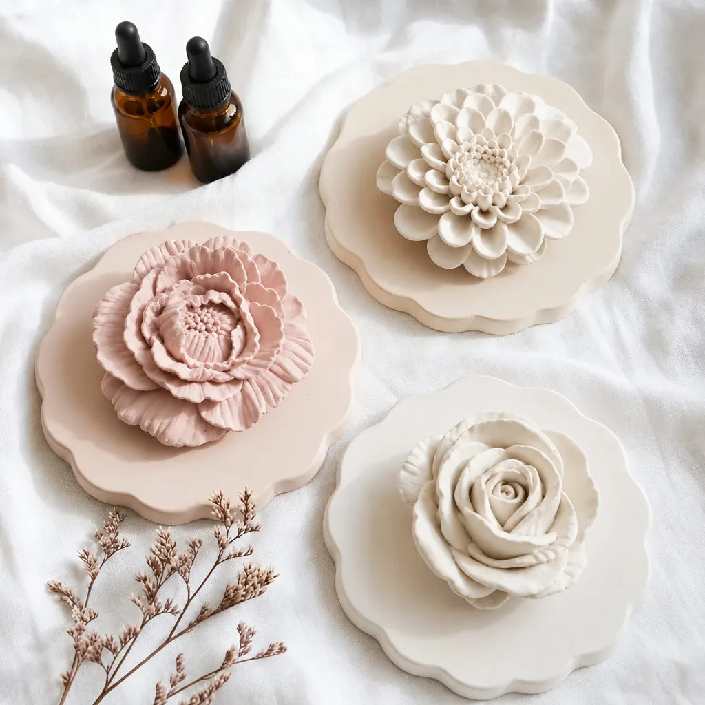 White and blush plaster flowers arranged on a surface